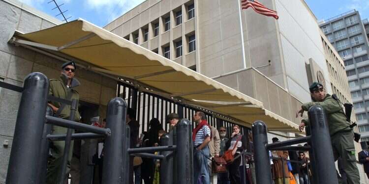 Israelis stand near the US Embassy Branch Office in Tel Aviv in 2003 'Join me as I burn US Embassy': German tourist's bizarre firebombing attempt