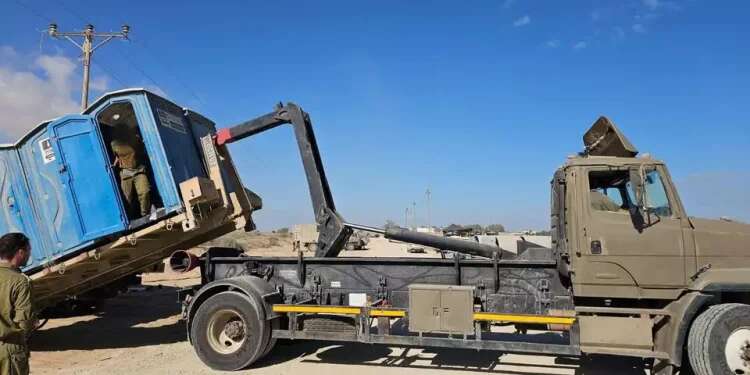 Portable toilet near Gaza loaded onto Truck, IDF officer still inside