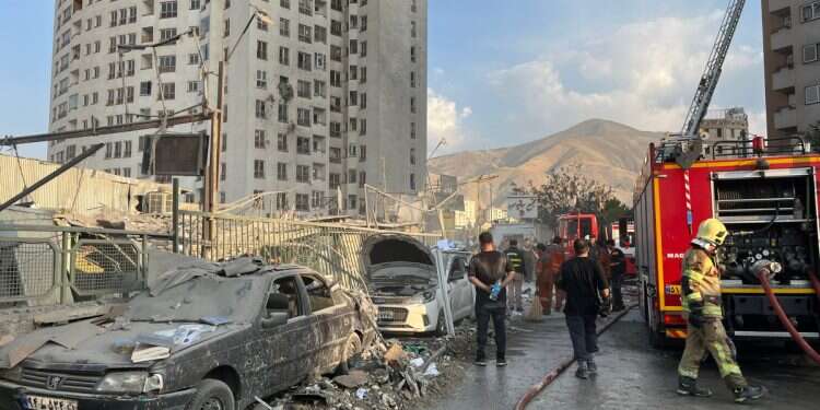 Fire fighters work outside a building that was hit by Israeli air strikes north of Tehran, Iran, 13 June 2025 Israeli strike could give Middle East new dawn