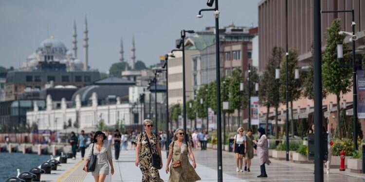 Visitors stroll in Galataport in Istanbul, on June 3, 2022 $30M stolen from tourists in Turkey credit card fraud scheme