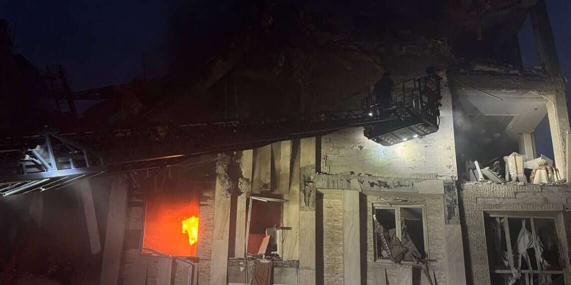 Iran's Revolutionary Guard Corps (IRGC) official Sepah News Telegram channel on June 13, 2025 reportedly shows a damaged building in Tehran on fire following Israeli strikes on the Iranian capital early in the morning LIVE UPDATES: Israel strikes Iran