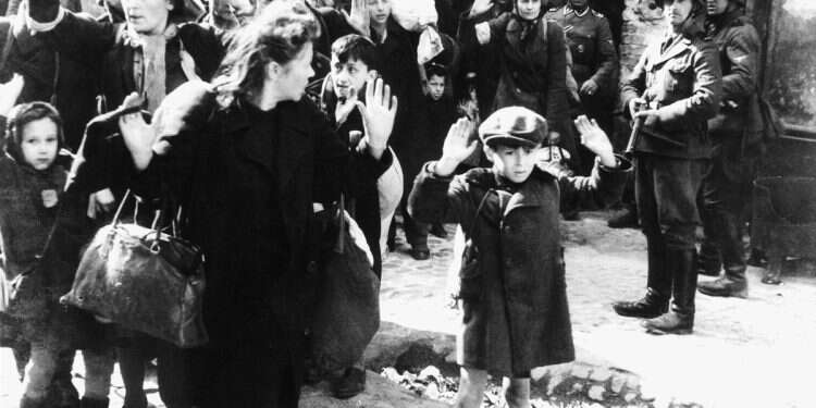 Jewish men, women, and children surrender to Nazi soldiers during the Warsaw Ghetto Uprising, May 1943 Granddaughter of infamous Nazi named new MI6 director