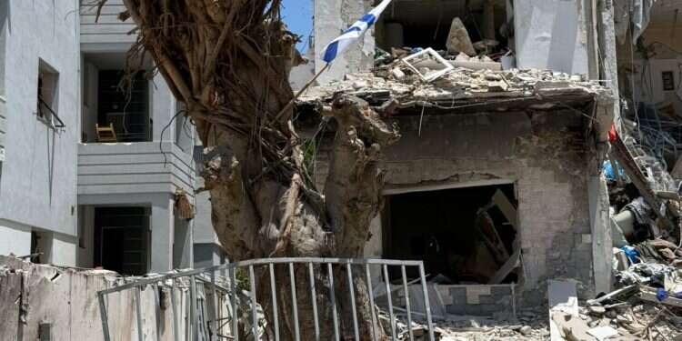 Even as missiles fall, Israelis choose to live