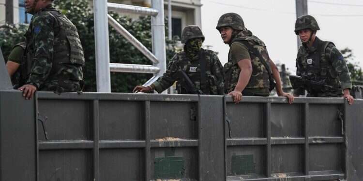 Royal Thai Army soldiers are transported on the back of an army truck in the Thai border province of Si Sa Ket on July 26, 2025 'Suddenly troubles arrived here too': Israeli tourists caught in Thailand-Cambodia tensions