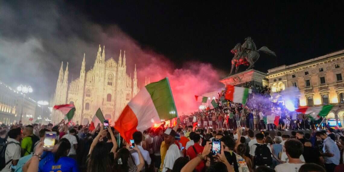 Italy's fans celebrate in front of the Duomo cathedral in Milan, Monday, July 12, 2021, after Italy beat England to win the Euro 2020 soccer championships in a final played at Wembley stadium in London 'Go home, killers': Jewish family attacked in Milan