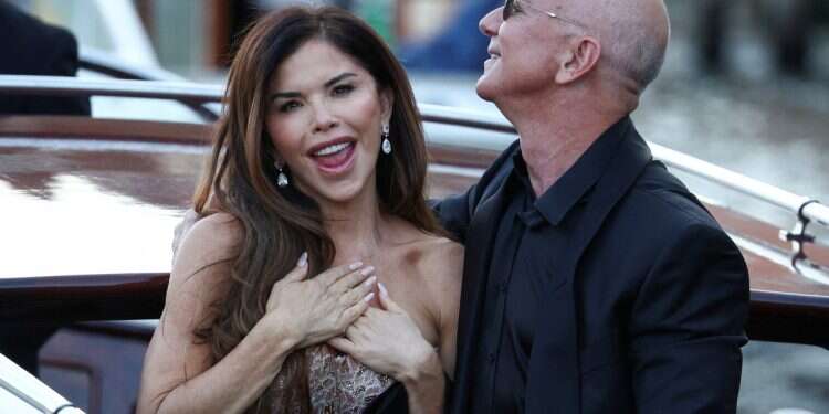 Amazon founder Jeff Bezos and his wife Lauren Sanchez Bezos travel on a boat, as they leave Aman Venice hotel, on the third day of their wedding festivities, in Venice, Italy, June 28, 2025 Is Bezos buying Vogue for his wife?