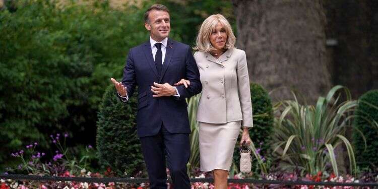 French President Emmanuel Macron and wife Brigitte arrive at 10 Downing Street in London, Wednesday, July 9, 2025 Macron sues Candace Owens for claiming 'France's first lady is a man'