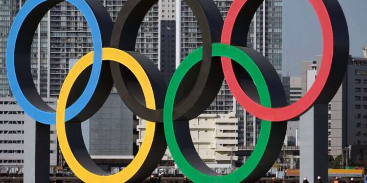 The Olympic rings are reinstalled after being taken down for maintenance ahead of the postponed Tokyo 2020 Olympics in the Odaiba section in Tokyo, Dec. 1, 2024 (Photo: AP /Eugene Hoshiko) 'Fair and safe': US Olympic committee bans trans women