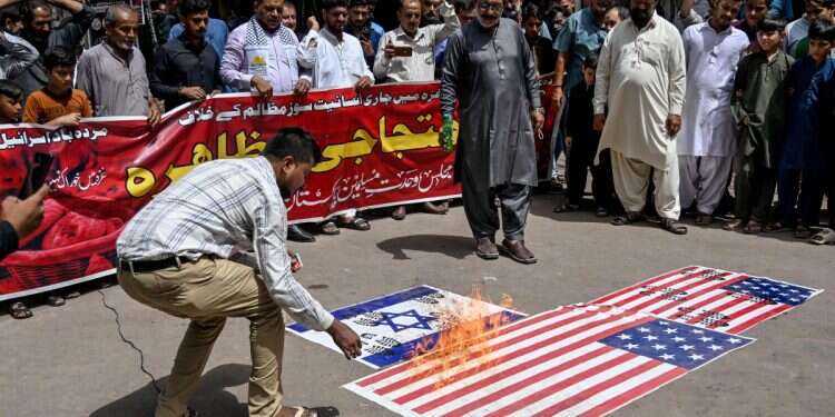 Shiite Muslims burn the national flags of Israel and the USA as they take part in an anti-Israel demonstration in Karachi, Pakistan, on July 25, 2025 Pakistan's schools indoctrinate students with Holocaust denial, Hitler praise