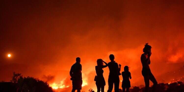 'It looks like judgment day': Wildfires force mass evacuations across Greece