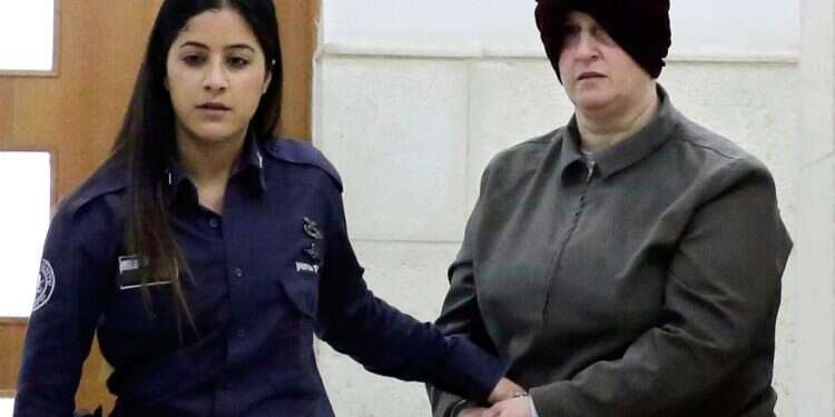 Australian Malka Leifer (R) is brought to a courtroom in Jerusalem on February 27, 2018 Israeli pedophile Malka Leifer filmed sexually assaulting prisoner in Melbourne jail
