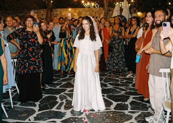 Fashion designer recreates Oct. 7 victim's wedding dress for grieving granddaughter