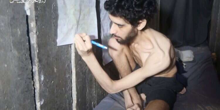 This image from an undated video released on August 1, 2025, by Hamas, shows Israeli hostage Evyatar David marking on a calendar inside the Gaza tunnel where he is being held Hostages first, Hamas later – medical intervention required immediately