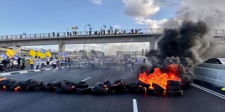 Protesters block a major highway in central Israel on the 'Day of Disruption' on August 26, 2025 Hostage families escalate fight with government in new 'Disruption Day'