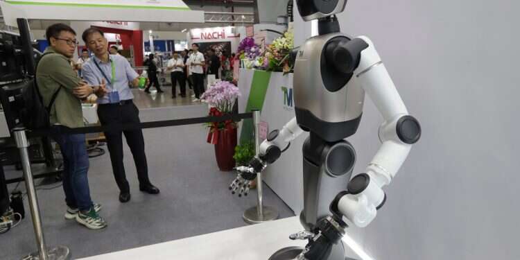 An AI Robot ''TM Xplore I'' displayed by Techman Robot during the Taiwan Automation Intelligence and Robot Show at Nangang Exhibition Center in Taipei, Taiwan, Wednesday, Aug. 20, 2025 Who will control the robots? New Zuckerberg, Musk front