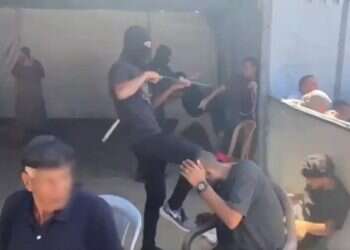 Hamas terrorists abuse Gazans before cheering crowd