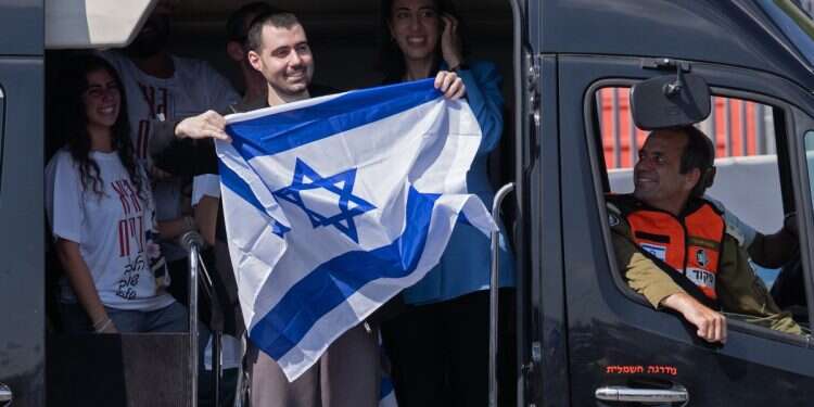 Former hostage Guy Gilboa-Dalal waves to supporters outside Beilinson Hospital in the Rabin Medical Centre on October 13, 2025 in Petah Tikva, Israel Foods freed hostages 'can't look at' after years of captivity