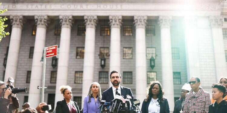 New York City Democratic mayoral candidate Zohran Mamdani (C) speaks at a press conference discussing the indictment of New York Attorney General Letitia James on October 10, 2025, in New York City Mamdani confronted by protesters demanding Hezbollah denunciation at Manhattan rally