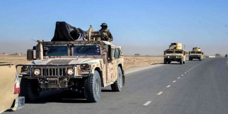 Taliban security personnel patrol on Humvees as they move in a convoy at the Mazal area of the Shorabak district near the Afghanistan-Pakistan border on October 12, 2025 Afghan forces claim 58 Pakistani troops killed in border clashes