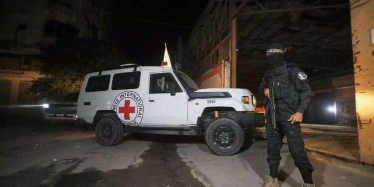 A Red Cross vehicle in the Gaza Strip receives the coffins of the deceased hostages. Photo: AP 2 more deceased hostages returned to Israel