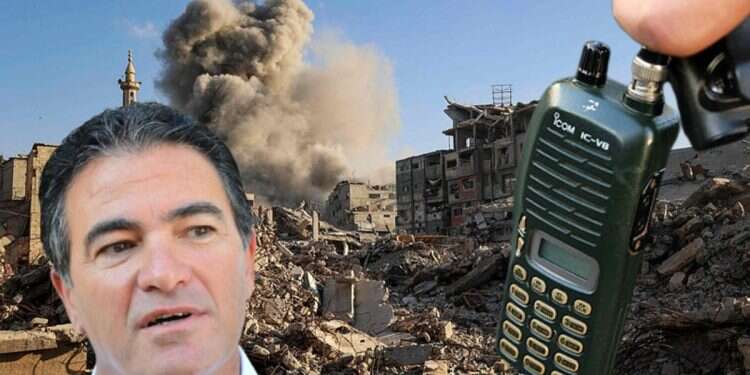 Yossi Cohen against the backdrop of Gaza and a walkie-talkie Ex-Mossad chief says pager operations extend to 'every country you can imagine'