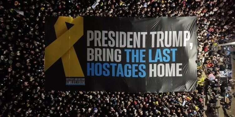 A sign addressing Trump at the rally. Photo: Aviv Atlas Families demand return of all hostages: 'Our struggle isn't over'