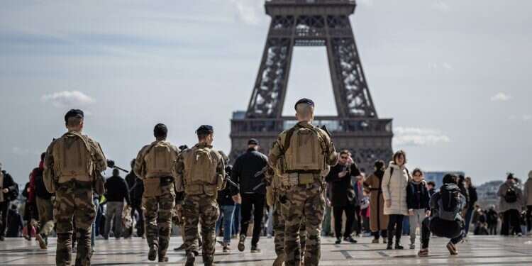 French soldiers patrol near the Eiffel Tower as part of the national security plan 'Vigipirate', in Paris, France, 25 March 2024 Middle East celebrates Mamdani's victory
