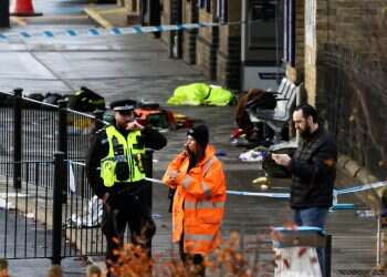 UK train hero saves many; suspect yells 'kill me'