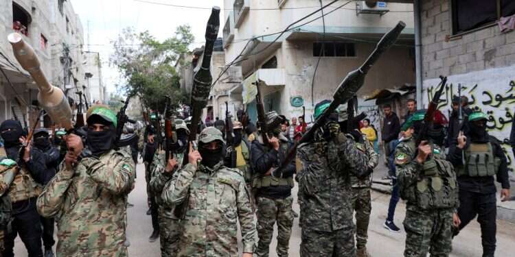 Hamas terrorists carry grenade launchers at a funeral Hamas seeks to keep weapons – Israel sends warning