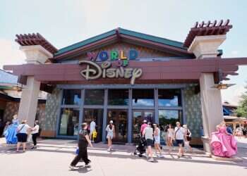 Tourists stroll by the World of Disney store at Disney Springs shopping and entertainment district Tuesday, Aug. 5, 2025, in Lake Buena Vista, Fla. | Photo: ohn Raoux/AP Something is going wrong at Disney World