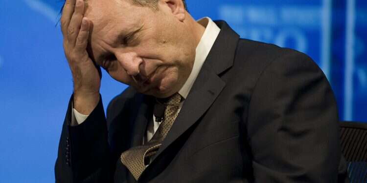 This November 17, 2008 file photo shows former US Treasury secretary and president-elect Barack Obama advisor Larry Summers listening during a gathering of corporate CEOs at an economic conference in Washington, DC Former treasury secretary disgraced in Epstein scandal, steps down from positions