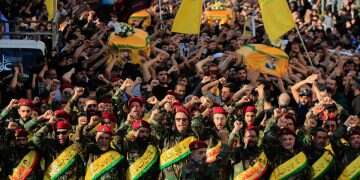 Hezbollah terrorists raise their fists and chant slogans as they march in the funeral procession of five comrades killed in Israeli strikes in recent days, in the southern town of Nabatieh, Lebanon, Sunday, Nov. 2, 2025 Hezbollah to respond to Israeli strikes