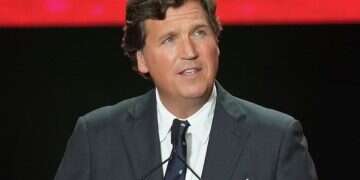 Tucker Carlson speaks at a memorial for Charlie Kirk, Sept. 21, 2025, in Glendale, Ariz. Defense of Tucker Carlson's antisemitism shakes conservative movement