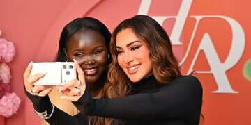 Huda Kattan (R) poses for a picture during a Huda Beauty event Huda Beauty in crisis as racism scandal erupts from within