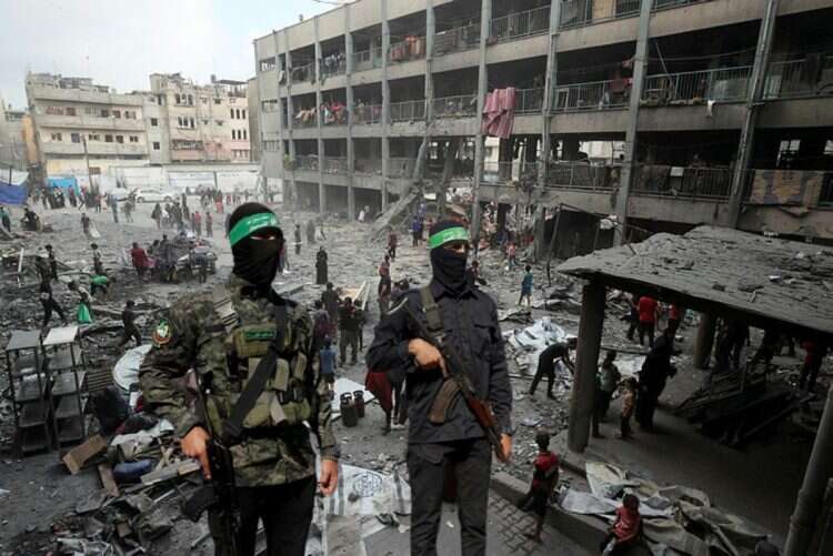 Hamas terrorists (backdrop: Gaza Strip)