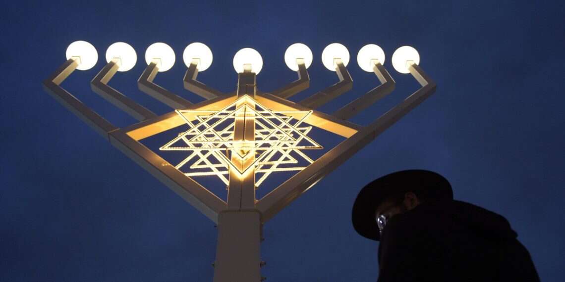 A illuminated Hanukkah menorah stands on Pariser Platz square in front of Brandenburg Gate in Berlin, Germany, 23 December 2014 Hanukkah 2025: Everything you need to know