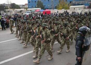 Syrian army soldiers march during a parade marking the first anniversary of the ousting of the Bashar Al-Assad regime in Damascus, Syria, 08 December 2025 'Zionist enemy': Slogan expose link between Hamas, Syria