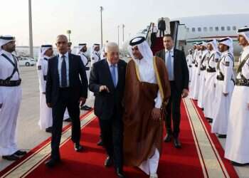 The Palestinian Authority's press office (PPO) shows Palestinian President Mahmud Abbas (L) received by Qatar's Deputy Prime Minister Saoud bin Abdulrahman Al Thani upon arrival in Doha on September 14, 2025, ahead of an Arab Islamic emergency summit Egypt, Turkey, Qatar pursue rival plans for phase II