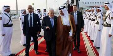 The Palestinian Authority's press office (PPO) shows Palestinian President Mahmud Abbas (L) received by Qatar's Deputy Prime Minister Saoud bin Abdulrahman Al Thani upon arrival in Doha on September 14, 2025, ahead of an Arab Islamic emergency summit Egypt, Turkey, Qatar pursue rival plans for phase II