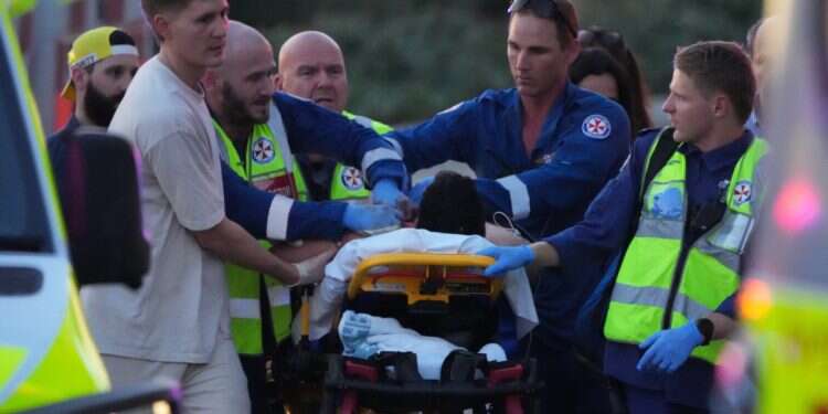 Emergency workers transport a person on a stretcher after a reported shooting at Bondi Beach, in Sydney, Sunday, Dec. 14, 2025 'You failed': Israel slams Australia after Hanukkah massacre