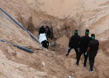 Hamas terrorists carry a dead body during a search for deceased hostages seized by Hamas during the October 7, 2023, attack on Israel, amid a ceasefire between Israel and Hamas, in Khan Younis, southern Gaza Strip, October 28, 2025 Behind the scenes of history