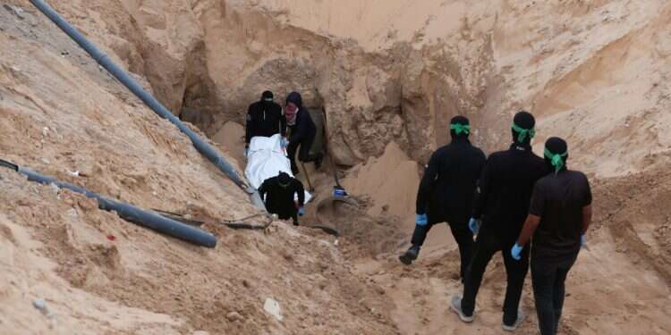 Hamas terrorists carry a dead body during a search for deceased hostages seized by Hamas during the October 7, 2023, attack on Israel, amid a ceasefire between Israel and Hamas, in Khan Younis, southern Gaza Strip, October 28, 2025 (Photo: Reuters/Ramadan Abed) Behind the scenes of history