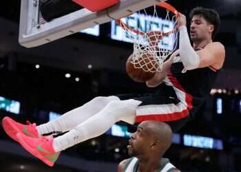 Milwaukee Bucks' Khris Middleton watches Portland Trail Blazers' Deni Avdija dunk during the second half of an NBA basketball game Saturday, Jan. 4, 2025, in Milwaukee Avdija sets career-high despite Portland's 3rd straight loss