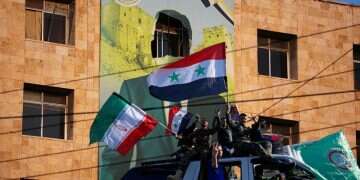 A view shows a damaged poster of Syria's President Bashar al-Assad in Aleppo, after the Syrian army said that dozens of its soldiers had been killed in a major attack by rebels who swept into the city, in Syria November 30, 2024 Revealed: Iran's message to Assad days before his fall