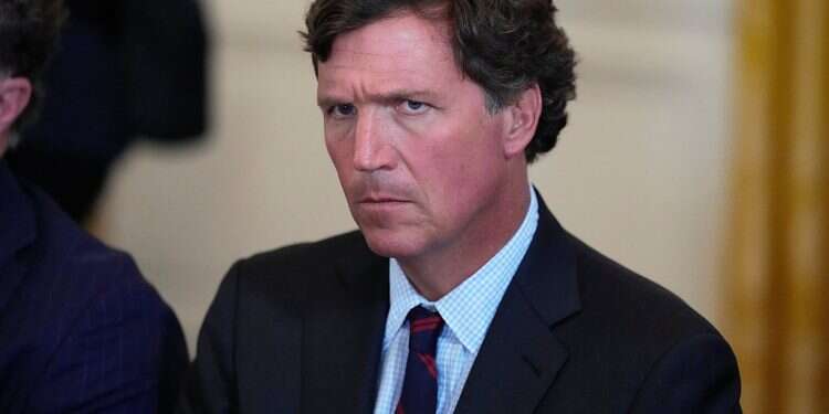 Tucker Carlson attends a meeting with President Donald Trump speaks and oil executives in the East Room of the White House, Friday, Jan. 9, 2026, in Washington Ted Cruz caught on tape blasting Trump trade war, Vance