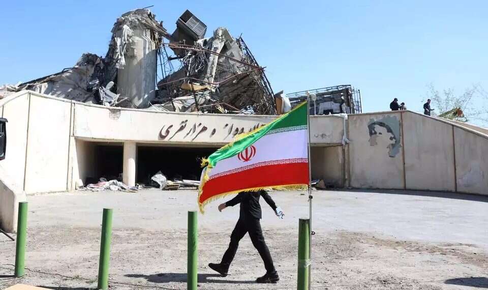 An Iranian civilian walks past a destroyed building in Tehran. Photo: EPA US rejects Iranian request for another meeting in Pakistan