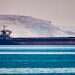 US Navy escorts ships through Hormuz as Iran threatens escalation