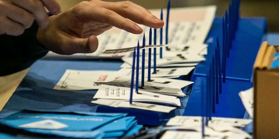 Vote counting at the Central Elections Committee. Photo: Oren Ben Hakoon Vote counting at the Central Elections Committee