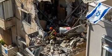 Israeli Home Front Command officers inspect an apartment building struck by an Iranian missile on March 22, 2026 in Tel Aviv, Israel Was it all worth it?