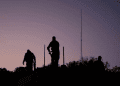 IDF soldiers at the border with Lebanon Tied hands: IDF demolition of strategic terror network in Lebanon halted at last minute